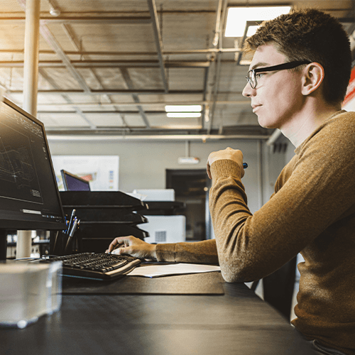 Industrial worker looking at industrial marketing trends that were recommended by a marketing agency