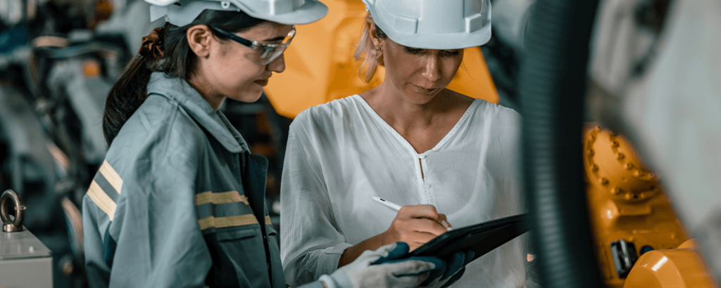 Manufacturing Team Working Together In A Manufacturing Setting
