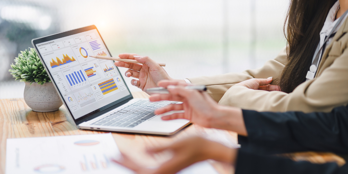 Marketing teams reviewing key metrics on a laptop screen