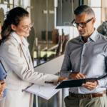Marketing professionals gathered together with CFO to discuss budget and ROI